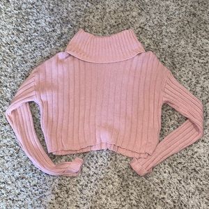Cropped knit turtleneck with cuffed sleeves